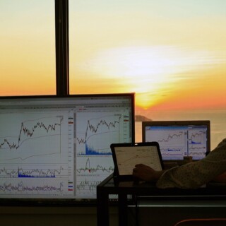 Stock market trading with a sunset backdrop
